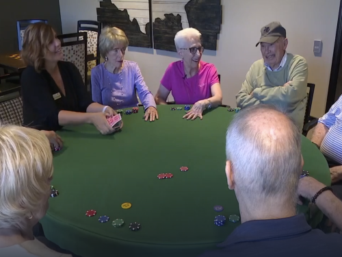 Seniors partaking in a game of poker at The Ridge Cottonwood