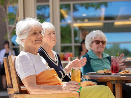 The Ridge Foothill women sitting in the sun with drinks.