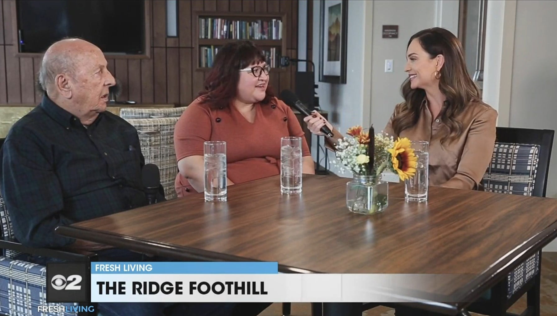 KUTV's Fresh Living interviews two people from The Ridge at a dining table at the senior living community
